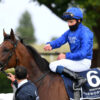 William Buick celebrates on board Ghaiyyath after winning the Group 1 Coronation Cup at Newmarket.